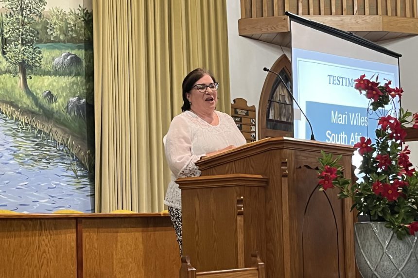 Rev. Mari Wiles speaking at Baptist on Missions Rally