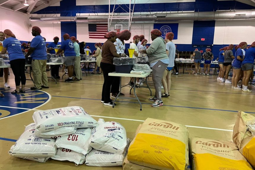 Students packing meals for Rise Against Hunger Event