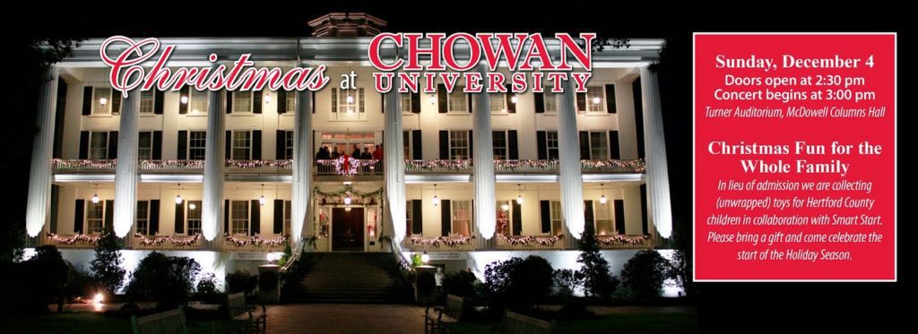 A decorated Columns building at night, with Christmas at Chowan Event in front
