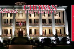 A decorated Columns building at night, with Christmas at Chowan Event in front