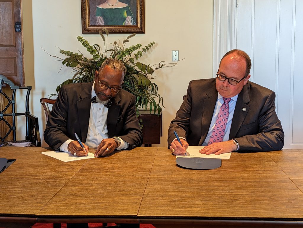 Dr. Dannie Williams, Superintendent of Weldon City Schools (left) and John Tayloe, Special Assistant to the President and Executive Director of Major Gifts and Planned Giving (right)