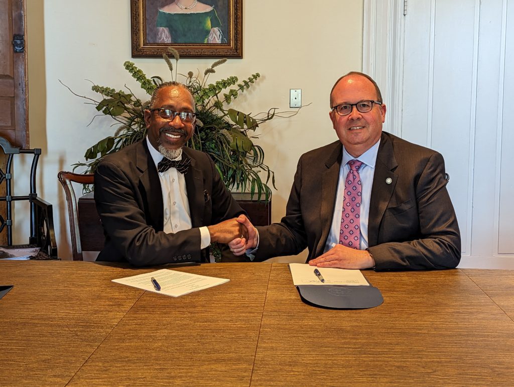Dr. Dannie Williams, Superintendent of Weldon City Schools (left) and John Tayloe, Special Assistant to the President and Executive Director of Major Gifts and Planned Giving (right)