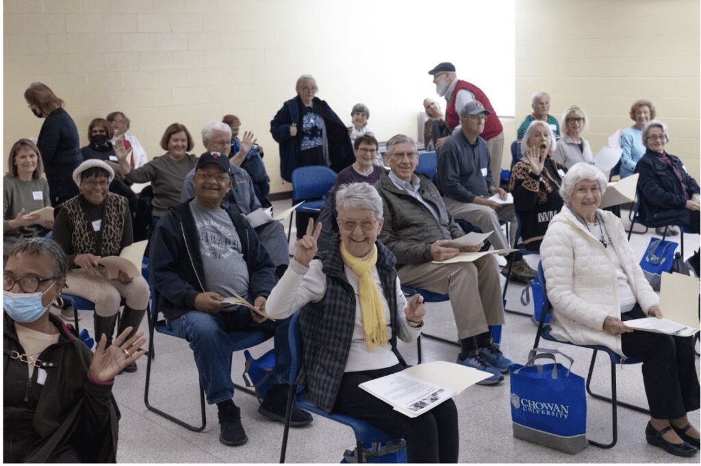 Guests at Chowan University's SeniorFEST participate in the “Mind and Body Fitness” breakout session hosted by ECU Health Wellness Center Ahoskie Coaches Jason Jenkins and Lisa Lane.