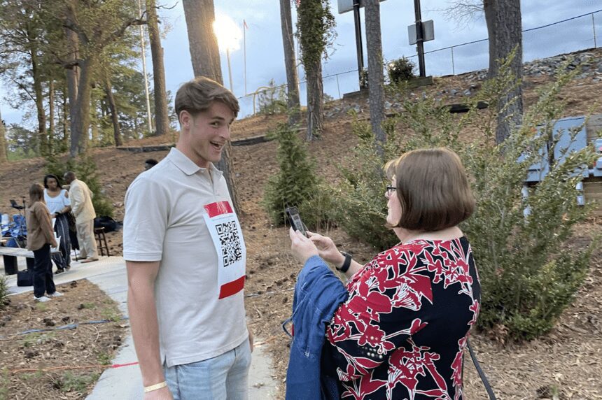 Chowan University Skyler Davies ’24 holds still with the QR code that will take Ministerial Board Member Rev. Anita Thompson to the songs and scripture for the night’s revival service. Chowan Campus Ministry hosted Holy Week Revival Services April 2-5.