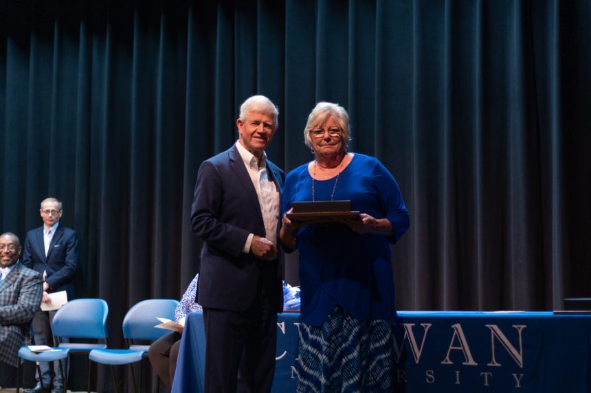 Deborah Hinton receives retirement gifts from Chuck Taylor