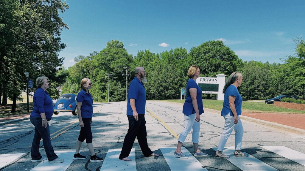 The Business Department recreates the "Abbey Road" album cover by The Beatles as a tribute to Eisenmenger
