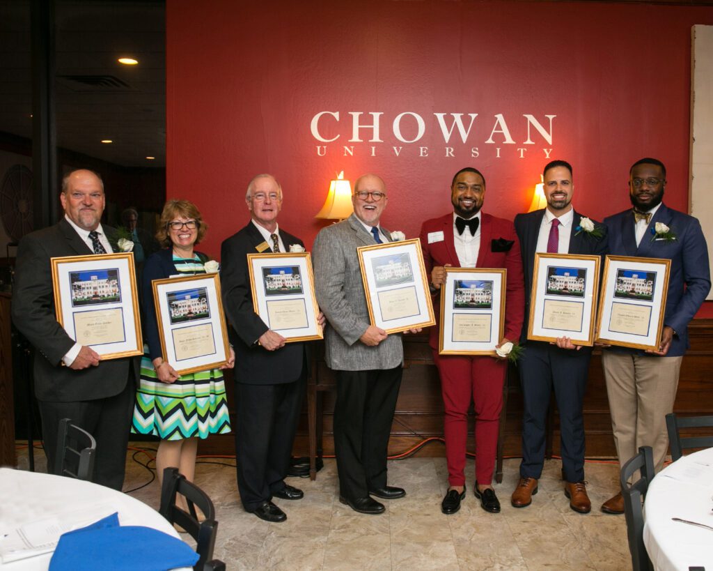 Pictured: Mark Parker (Community Service), Angie Salerno (Distinguished Alumna), James Moore (Distinguished Alumnus), Alton Parker (Community Service), Chris Moore (Distinguished Alumnus), Nicola Khoury (Distinguished Alumnus), Vaughn Byrd (Distinguished Alumnus). Not pictured Grace Brown (Community Service).