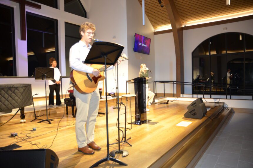 Gabe Espiritu playing the guitar at Wednesday Night Worship.