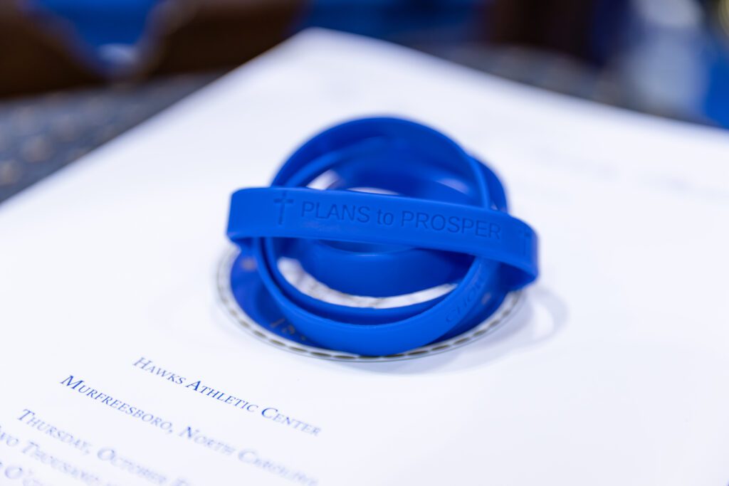 Plans to Prosper bracelets on the Program for the Inauguration of Dr. Rosemary M. Thomas.