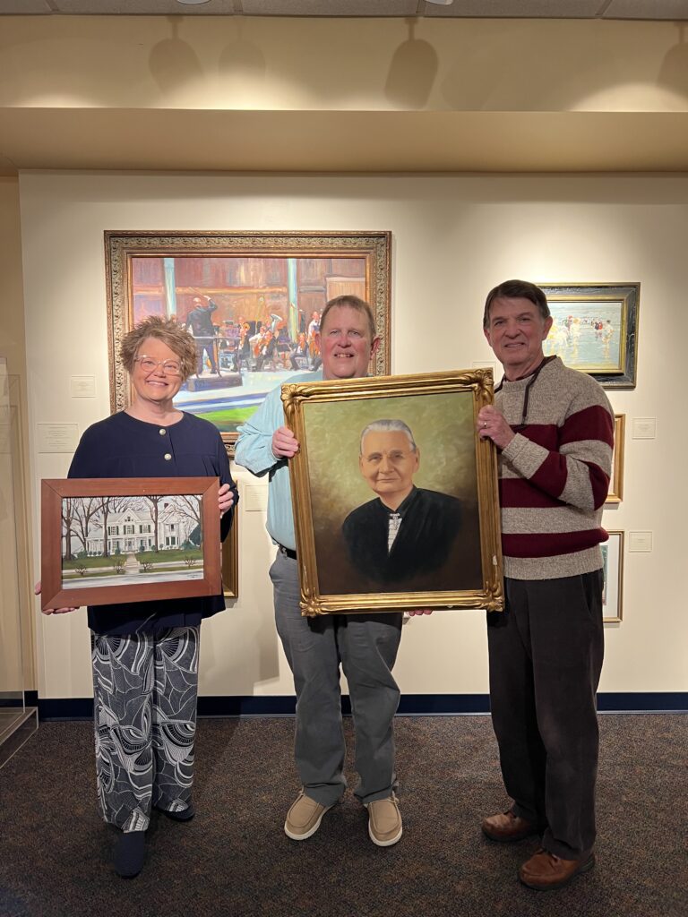 Chowan University President Dr. Rosemary M. Thomas proudly holds a painting of Olevia Frances Benthall Jenkins’ home, while Drs. Stephen S. Marsh and William H. Marsh present the portrait of their great-grandmother, donated to the Wayland Jenkins Fine Arts Center in honor of her lasting legacy.